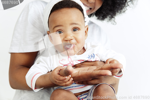 Image of Portrait of beautiful african woman holding on hands her little baby