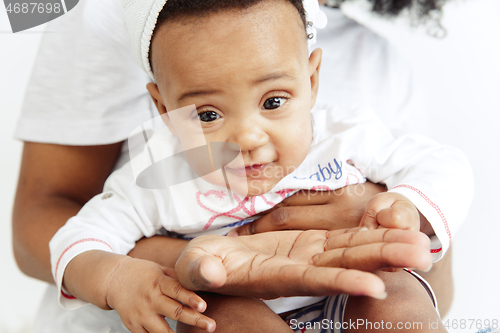 Image of Portrait of beautiful african woman holding on hands her little baby