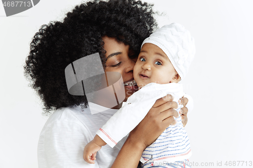 Image of Portrait of beautiful african woman holding on hands her little baby