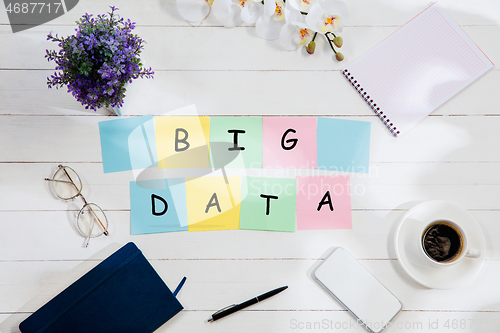 Image of BIG DATA. Message at colorful note papers on a desk background.