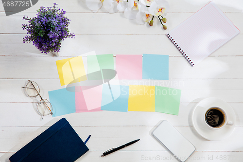 Image of Message at colorful note papers on a desk background.