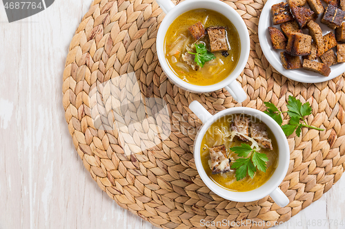 Image of Traditional French onion soup with toasted bread croutons 