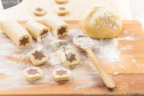 Image of Baking christmas cookies with chocolate star. 