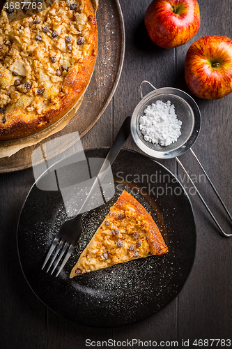 Image of Delicious apple pie with chocolate pieces and ingredients for Thanksgiving