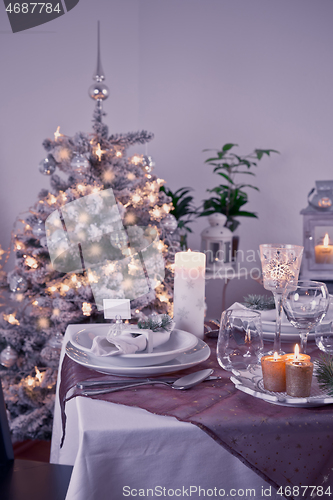 Image of Table setting for celebration Christmas and New Year Holidays. Festive table at home. 