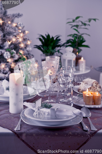 Image of Table setting for celebration Christmas and New Year Holidays. Festive table at home. 