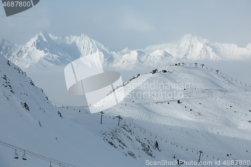 Image of Snowy skiing slopes from the top