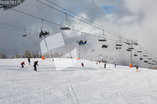 Image of Skiing slopes, with many people