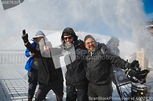 Image of Skiers having fun ona restaurant balcony