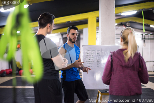 Image of athletes getting instructions from trainer