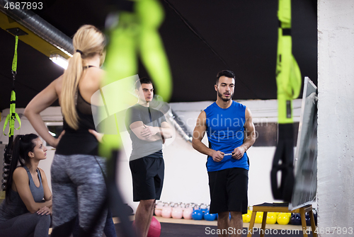 Image of athletes getting instructions from trainer