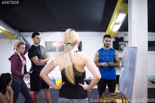 Image of athletes getting instructions from trainer