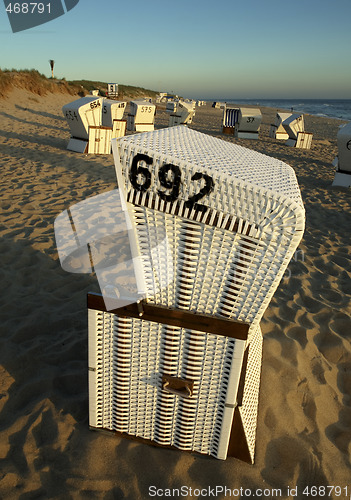 Image of One Beach Chair at Sunset