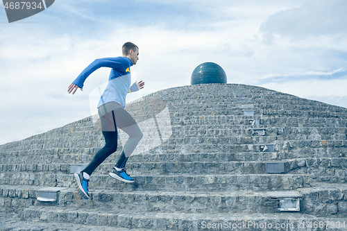 Image of Man running on city background at morning.