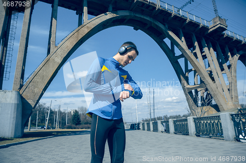 Image of Man on city background at morning. Healthy lifestyle concept.