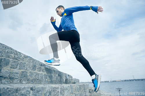 Image of Man running on city background at morning.