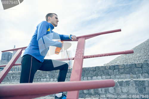 Image of Man on city background at morning. Healthy lifestyle concept.