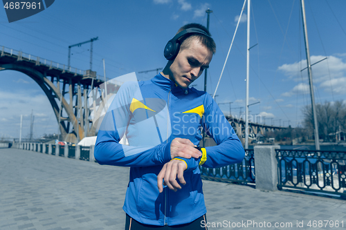 Image of Man on city background at morning. Healthy lifestyle concept.