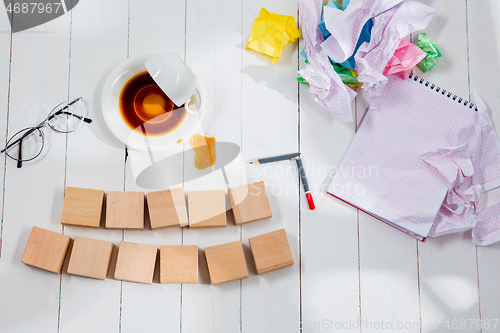 Image of Message in wooden cubes on a desk background.