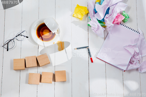 Image of Message in wooden cubes on a desk background.