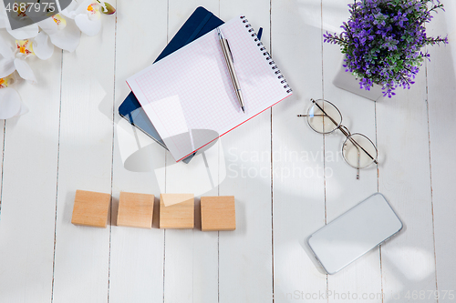 Image of Message at wooden cubes on a desk background.