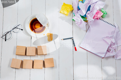 Image of Message in wooden cubes on a desk background.