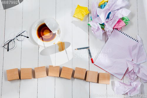 Image of Message in wooden cubes on a desk background.