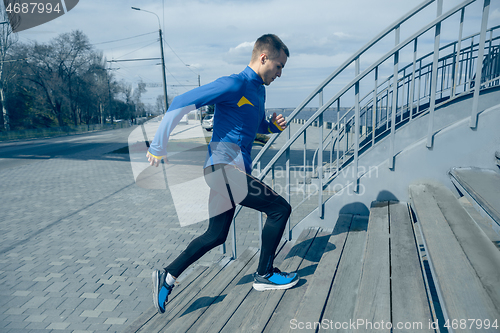 Image of Man running on city background at morning.