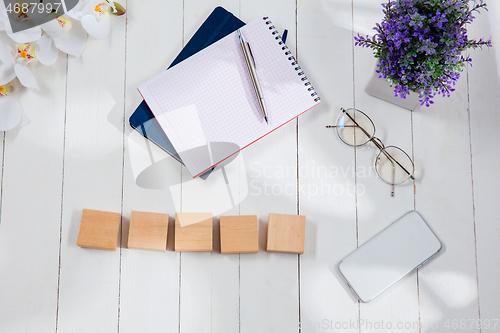 Image of Message at wooden cubes on a desk background.