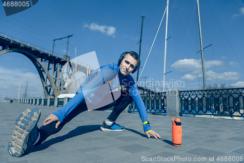 Image of Man running on city background at morning