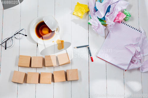 Image of Message in wooden cubes on a desk background.