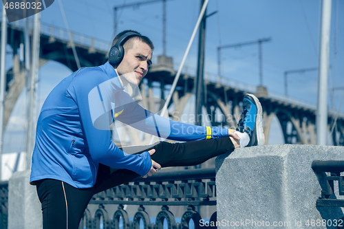 Image of Man running on city background at morning