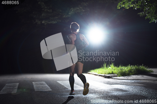 Image of female runner training for marathon