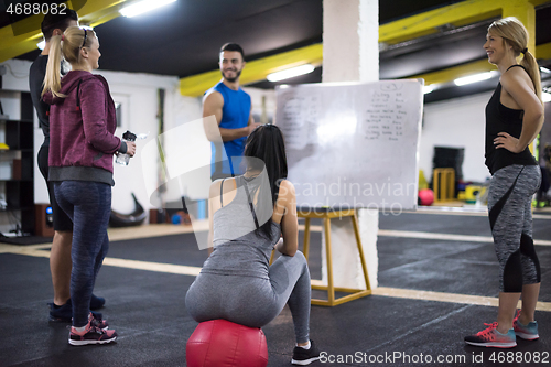 Image of athletes getting instructions from trainer