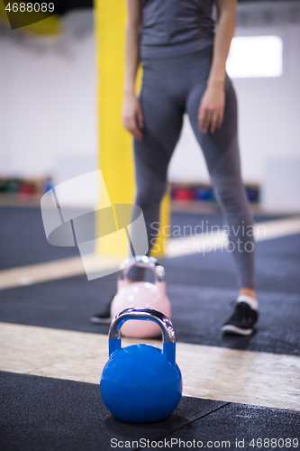 Image of woman exercise with fitness kettlebell