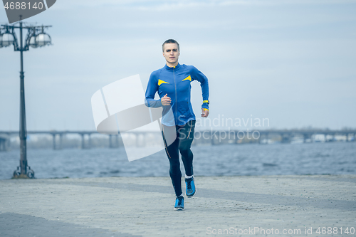 Image of Man running on city background at morning.