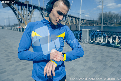 Image of Man on city background at morning. Healthy lifestyle concept.