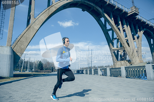 Image of Man running on city background at morning.