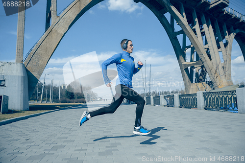 Image of Man running on city background at morning.