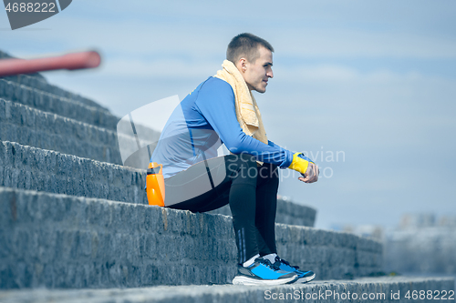 Image of Man on city background at morning. Healthy lifestyle concept.