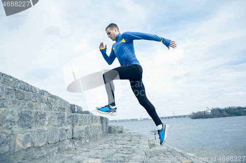 Image of Man running on city background at morning.