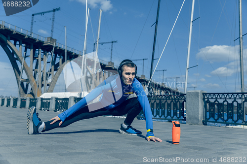 Image of Man running on city background at morning