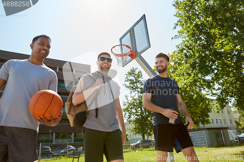 Image of group of male friends going to play basketball