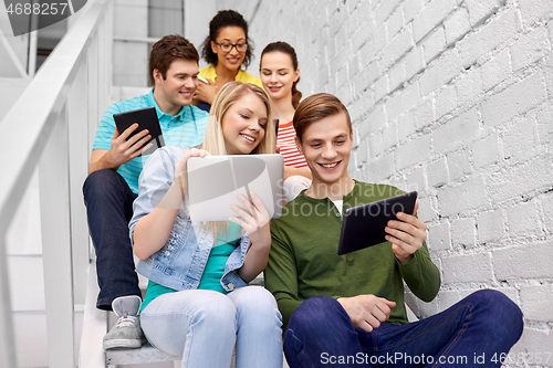 Image of high school students with tablet computers