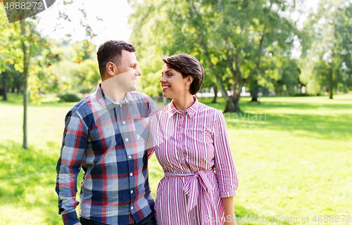 Image of happy couple in summer park