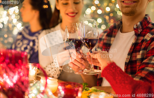 Image of close up of friends with wine celebrate christmas