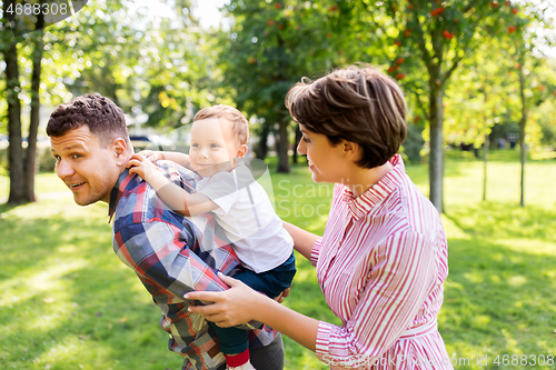 Image of happy family having fun at summer park