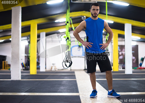 Image of Young  man doing pushups