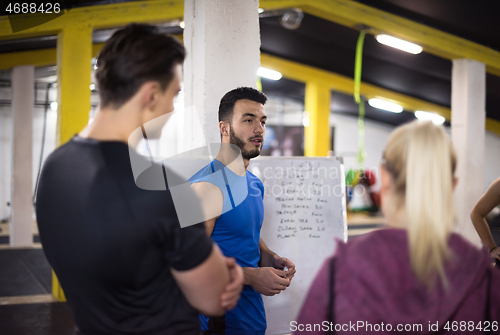 Image of athletes getting instructions from trainer