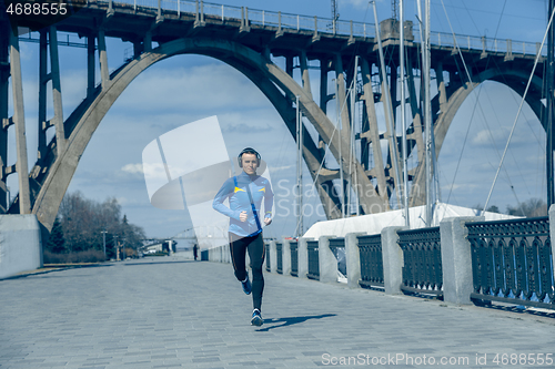 Image of Man running on city background at morning.